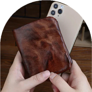 Homepage Creased Heritage Compact Fold luxury wallet in brown leather premium compact design held with phone