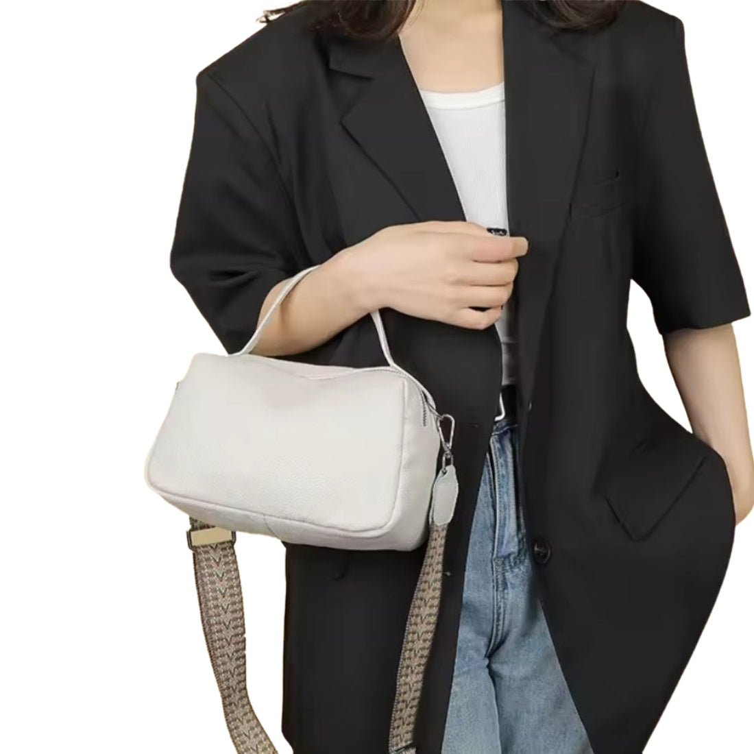 Timeless City Compact crossbody bag in beige pebbled genuine luxury leather with premium silver hardware short top leather handle and detachable upscale strap featuring beige woven pattern person wearing in lifestyle setting