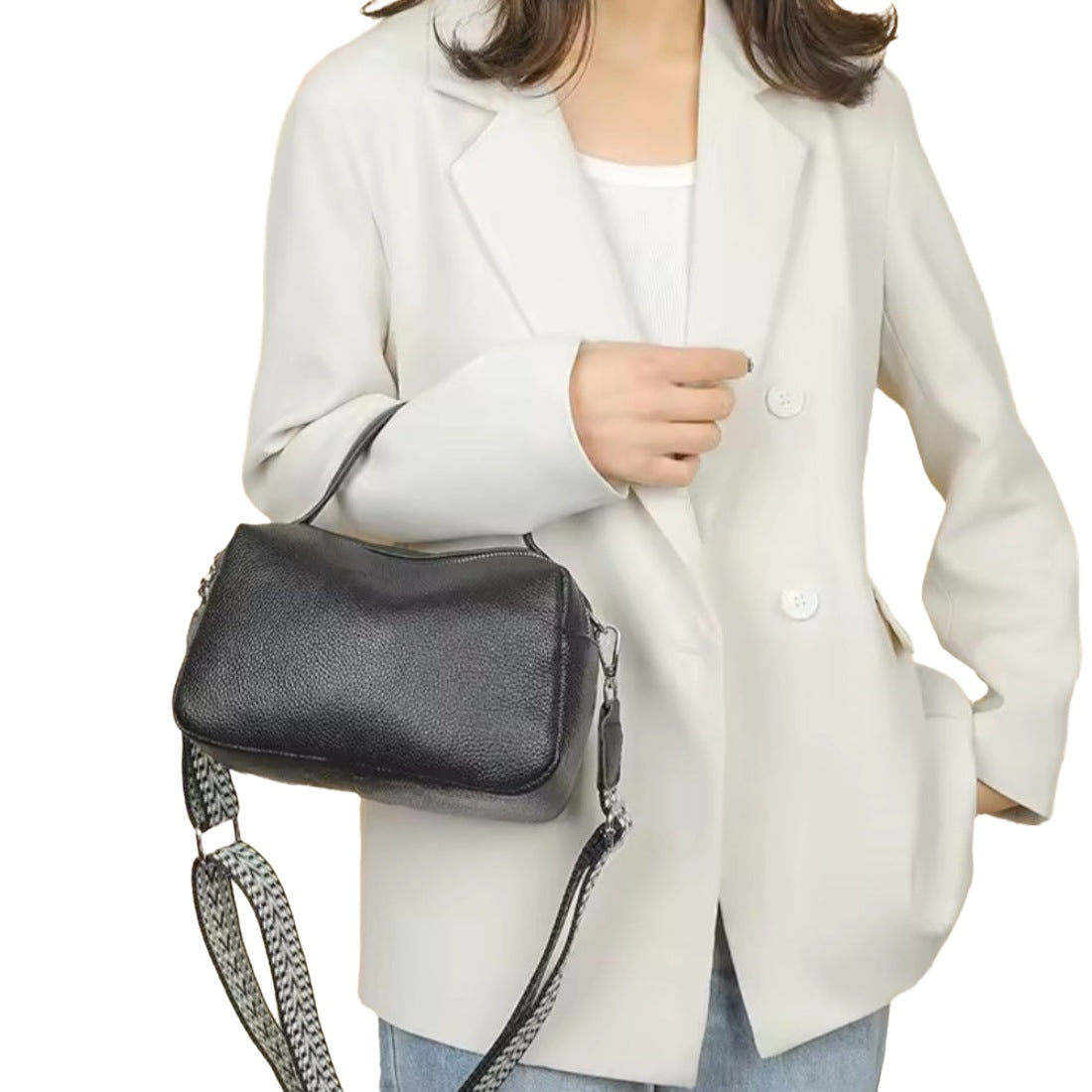 Timeless City Compact crossbody bag in luxury black pebbled genuine leather with premium silver hardware worn over shoulder with thick patterned upscale strap person displayed in lifestyle setting