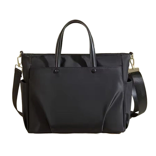 Timeless Commuter Tote black waterproof Oxford tote with dual compartments padded laptop sleeve front zip pocket anti theft pocket and adjustable shoulder strap