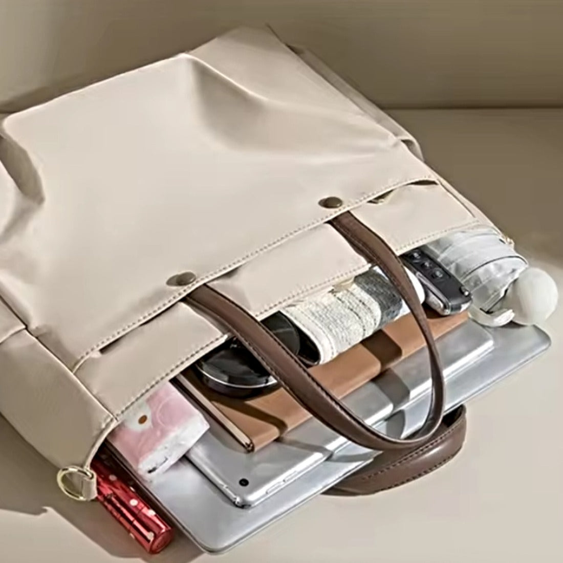 Overhead view of upscale premium Timeless Commuter Tote filled with tech and accessories showing roomy capacity