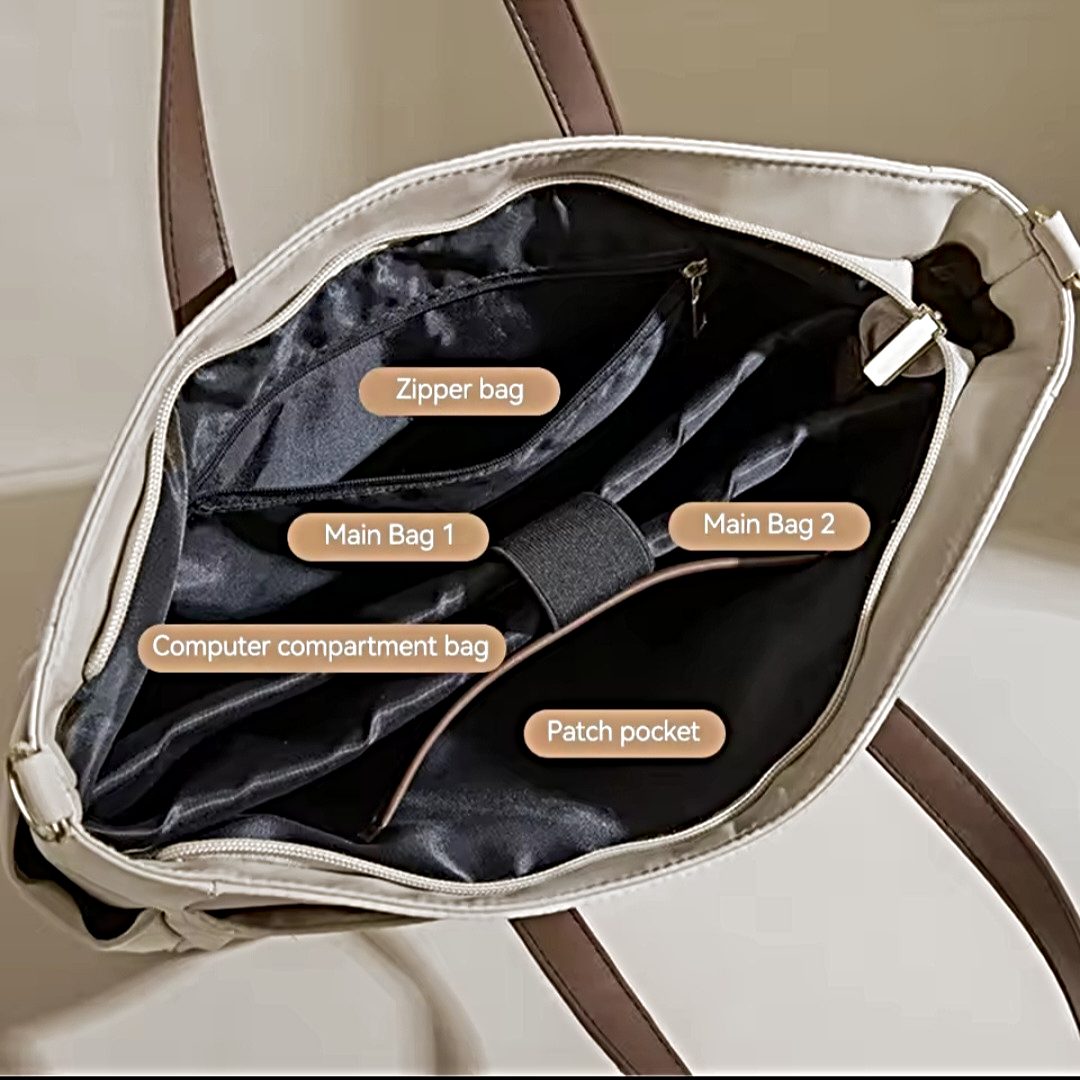 Interior of upscale premium Timeless Commuter Tote in beige with dual main compartments padded laptop sleeve inner zip pocket and patch pocket for organized storage