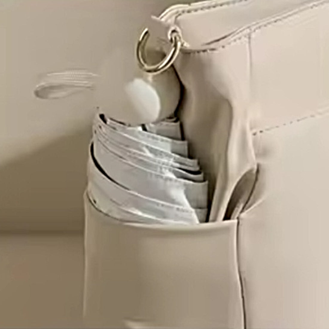 Close up of premium upscale Timeless Commuter Tote side pocket for umbrella water bottle or quick access items