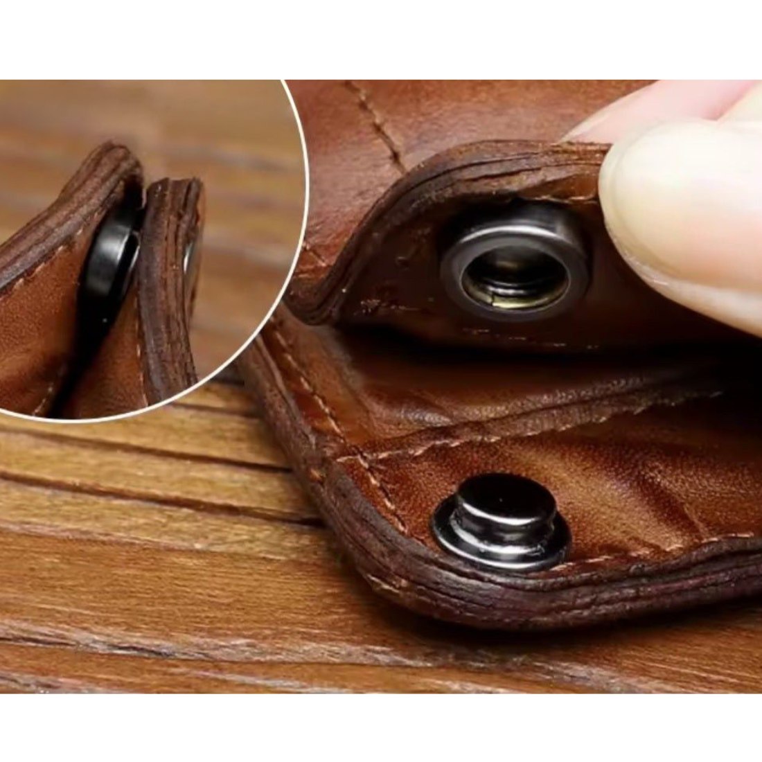 Detail view of secure snap fastener on brown Creased Heritage Fold luxury vintage genuine leather wallet, highlighting craftsmanship and durability