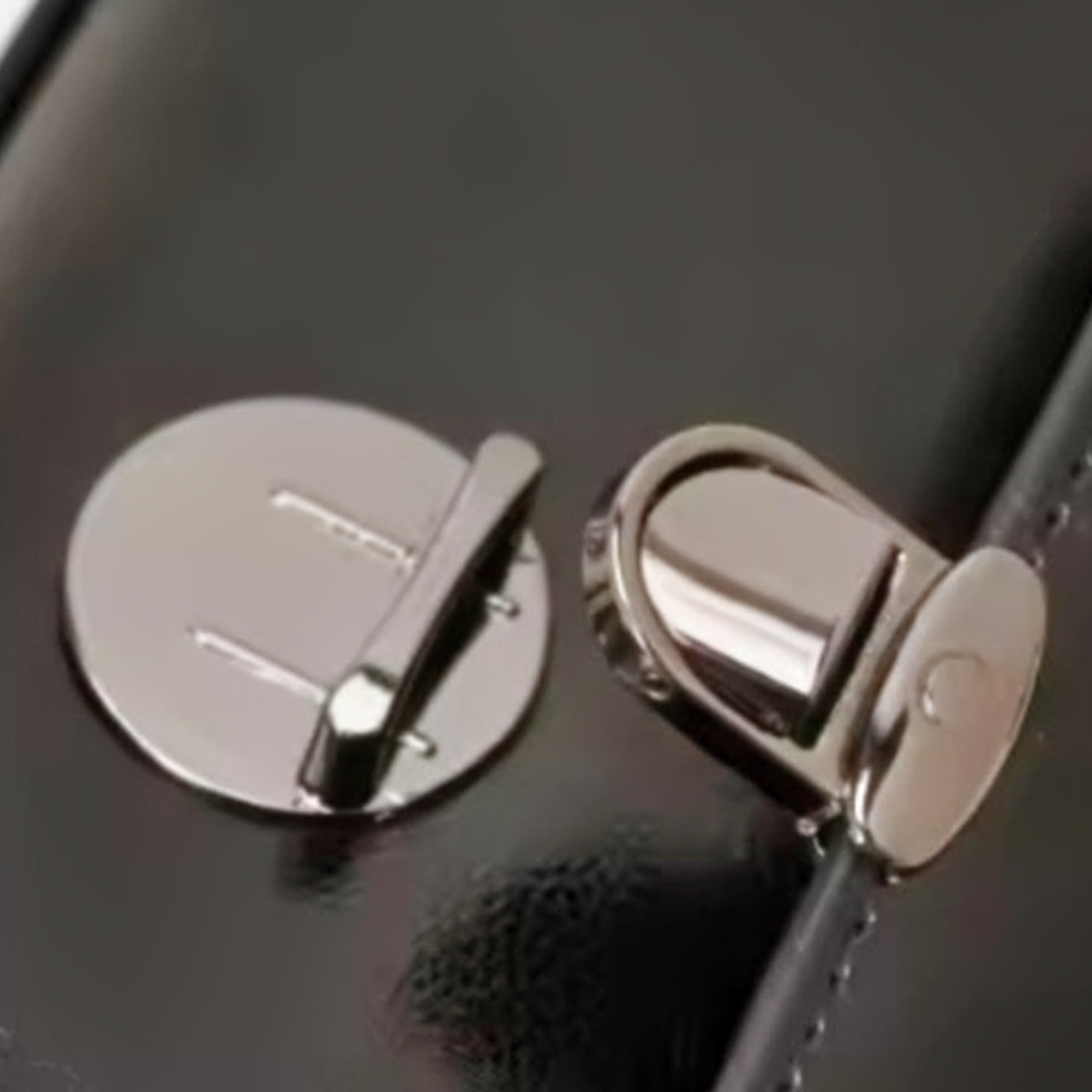 Metro Fold Carry in black silver hardware close-up premium genuine luxury leather details