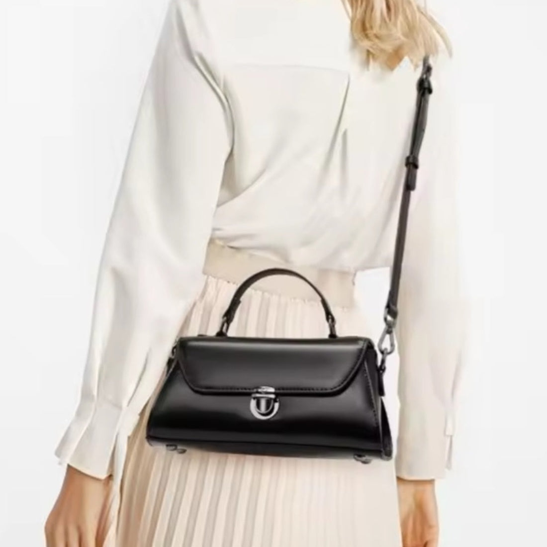 Metro Fold Carry upscale luxury black genuine leather compact crossbody shown on model