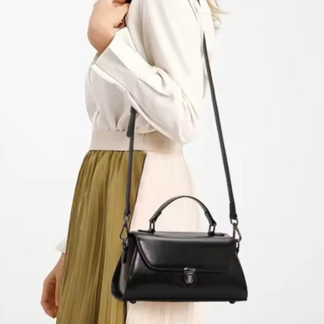 Metro Fold Carry premium luxury black leather tote with sleek minimalist design worn on shoulder