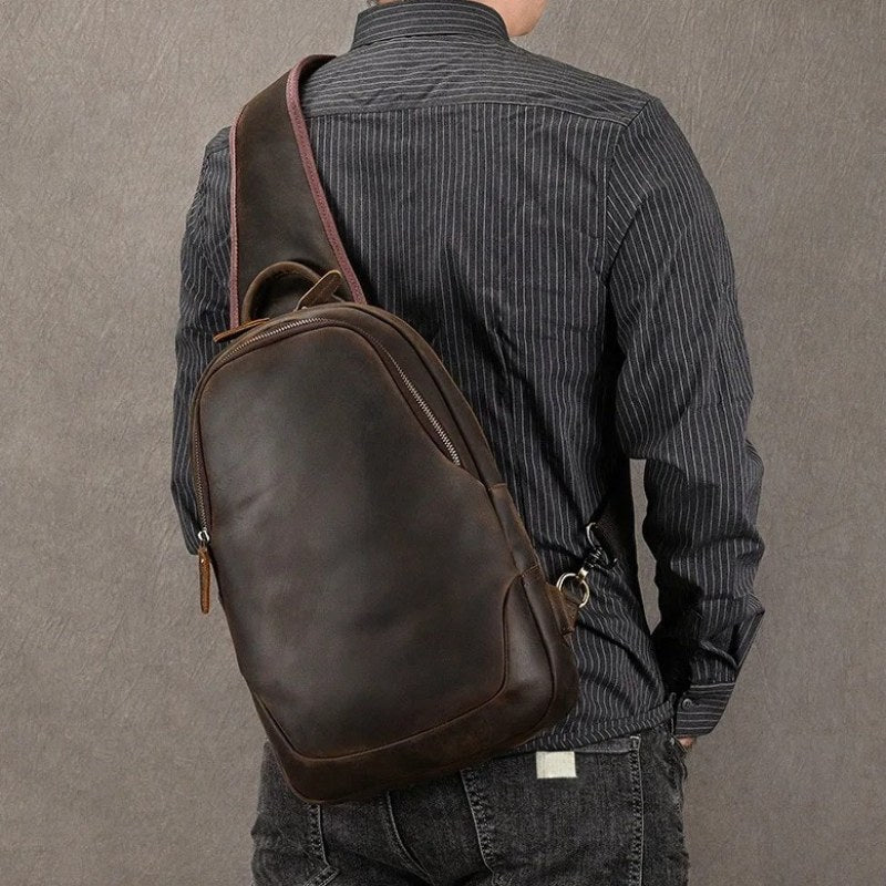 Frontier Leather Sling men's crazy horse leather crossbody bag in dark brown worn over the shoulder