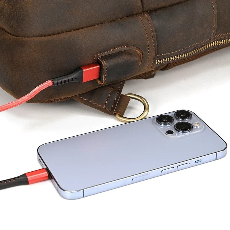 Frontier Leather Sling bag for men, brown crazy horse leather with built-in USB charging port, close-up view.