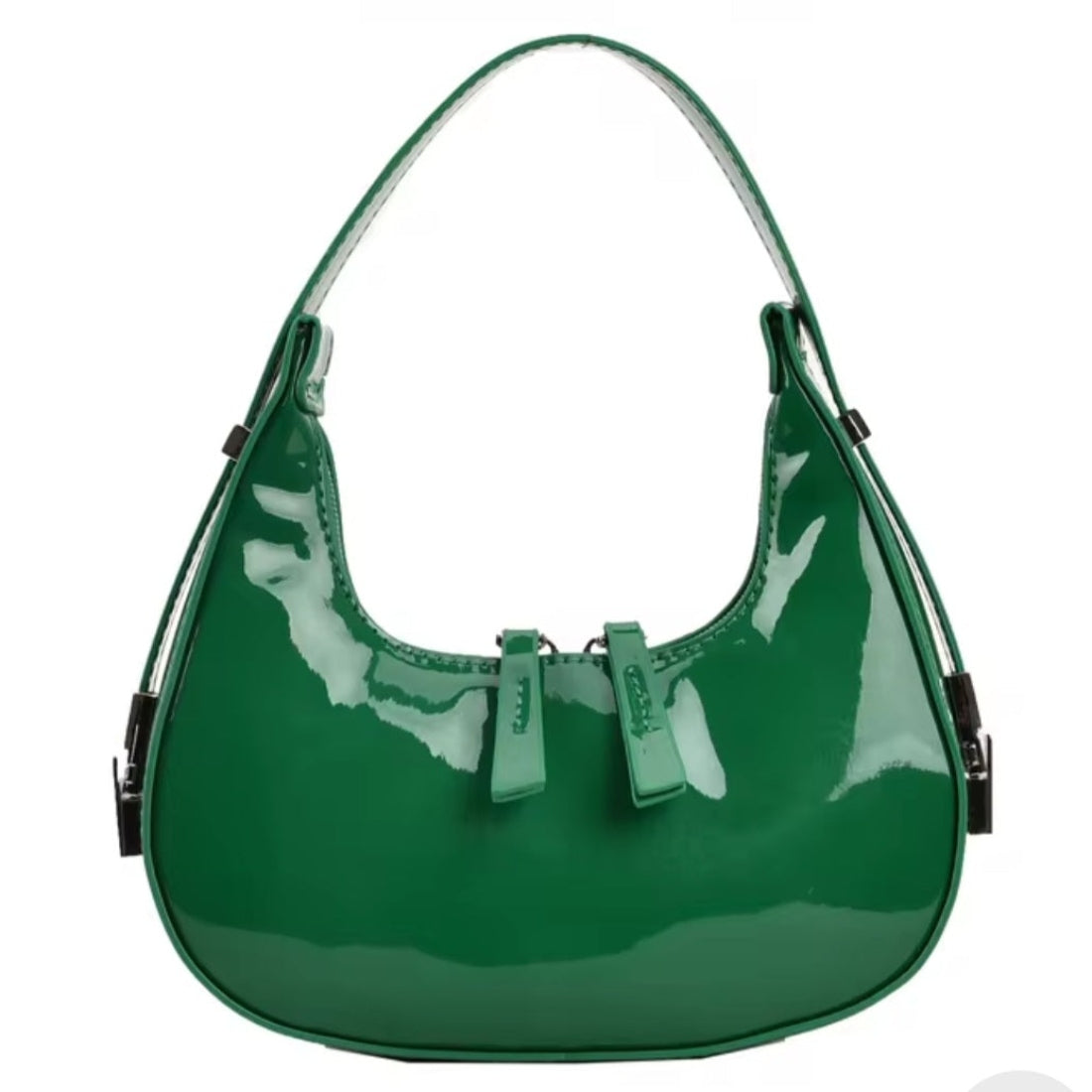 Luna Curve Carry luxury bag in glossy green vegan leather with crescent silhouette single shoulder strap and front bow accent silver hardware showcasing vibrant modern styling polished premium finish and compact everyday elegance