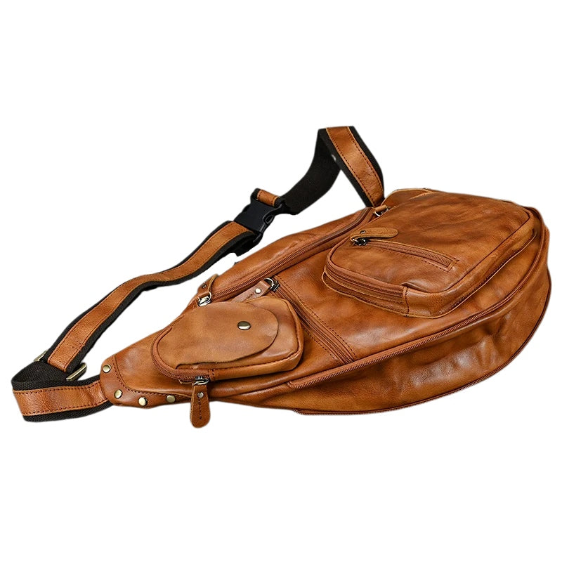 Heritage Nomad Sling men's crossbody bag in brown leather with adjustable strap, coin pouch and zip pockets