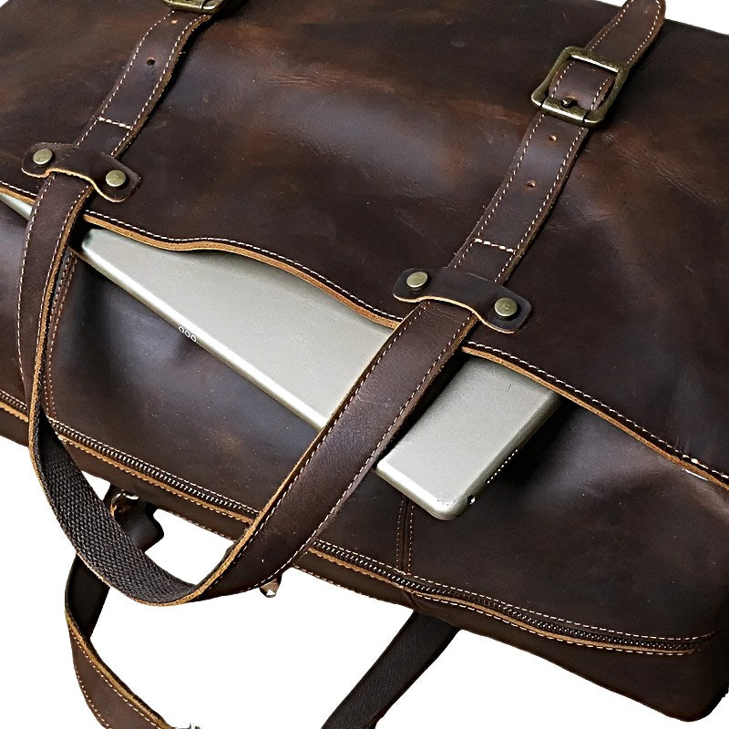 landmark leather weekender brown leather duffle travel bag with a laptop inside