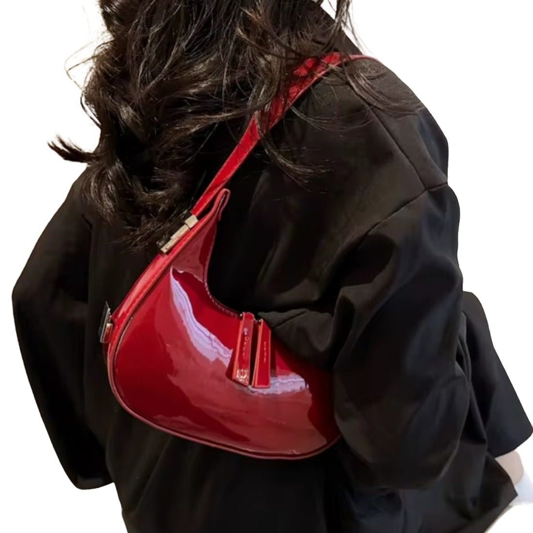 Luna Curve Carry luxury bag in glossy red vegan leather worn by model featuring premium silver hardware accents crescent silhouette shoulder strap zipper closure and tassel detail showcasing bold modern styling polished premium finish and compact everyday elegance