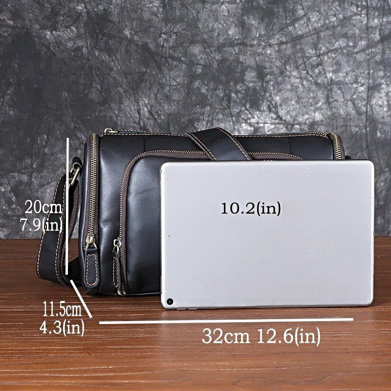 Black metroline leather weekender mens leather crossbody bag with measurements compared with a 10.2 in tablet