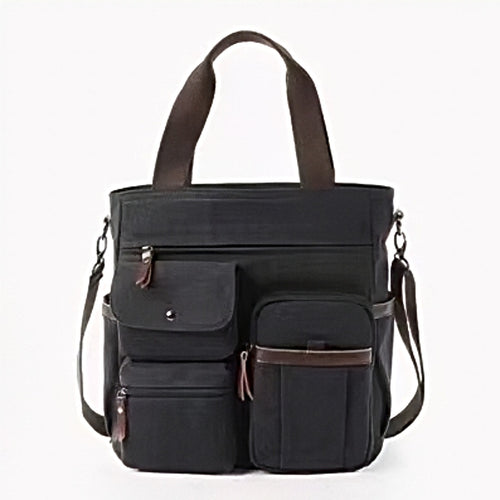 Nomad Utility Carry black canvas bag brown leather accents dual front flap pockets top handles adjustable shoulder strap zippered compartments mens utility tote