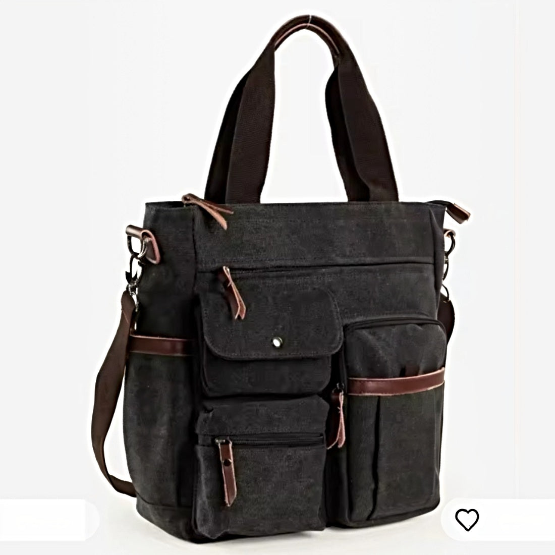 Nomad Utility Carry in black canvas with brown leather accents featuring dual front flap pockets top handles adjustable shoulder strap and zippered compartments showcasing durable premium construction and rugged upscale versatility for everyday carry