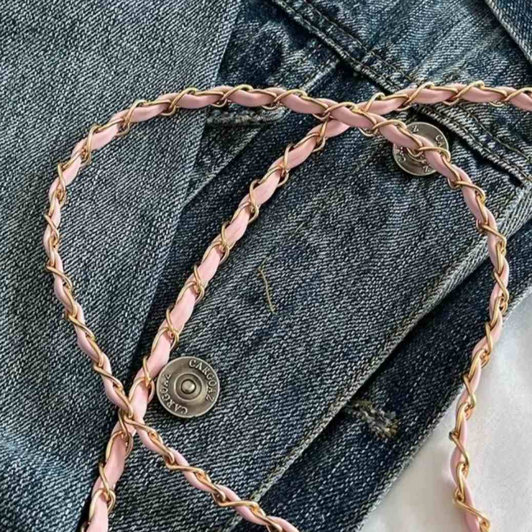 Timeless Petite Luxe luxury crossbody bag highlighting pink and gold chain accented strap texture and upscale accessory styling in lifestyle setting