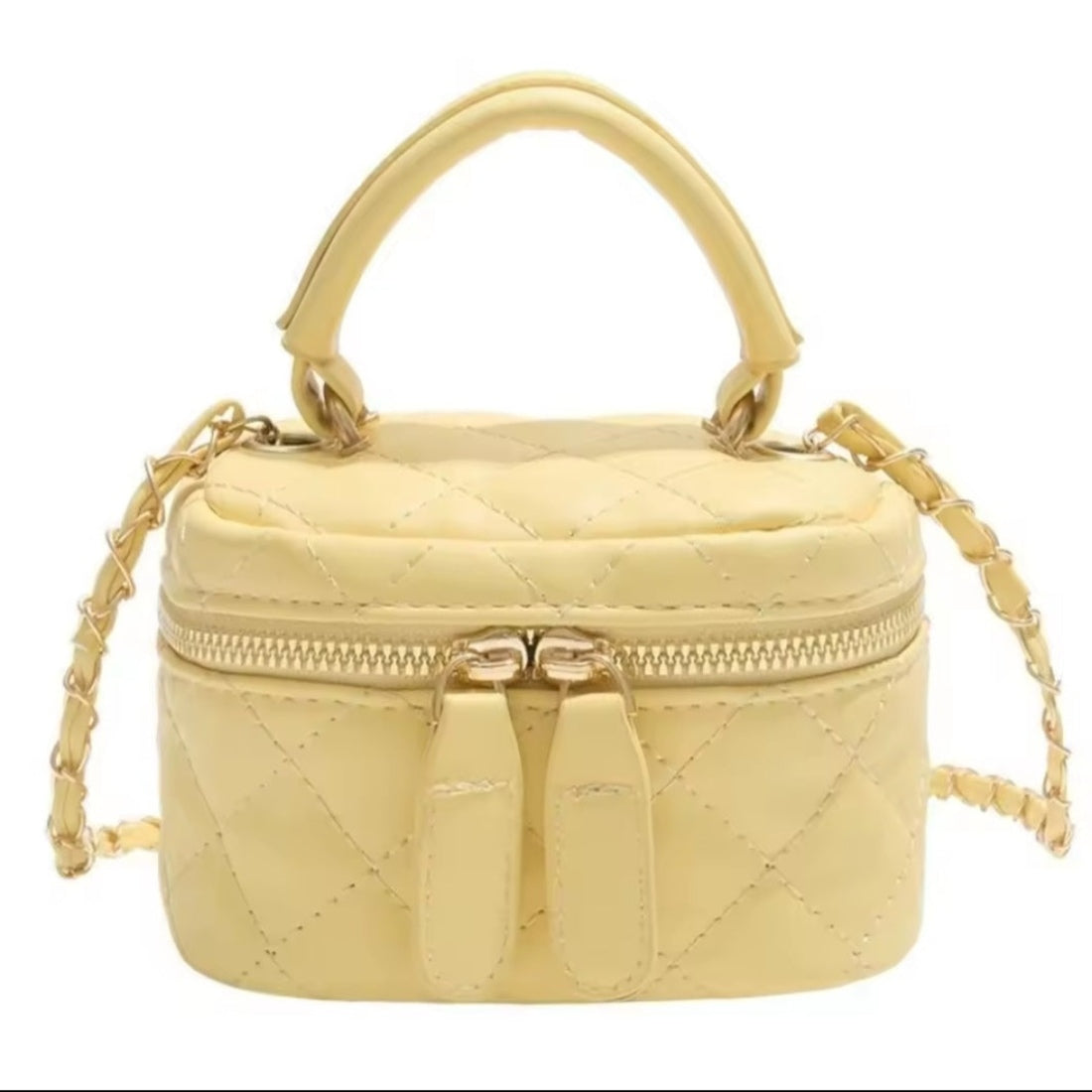 Timeless Petite Luxe  crossbody bag in vibrant yellow quilted elegant vegan leather with luxurious gold hardware short top handle and upscale gold chain wrapped strap cheerful upscale design with premium texture