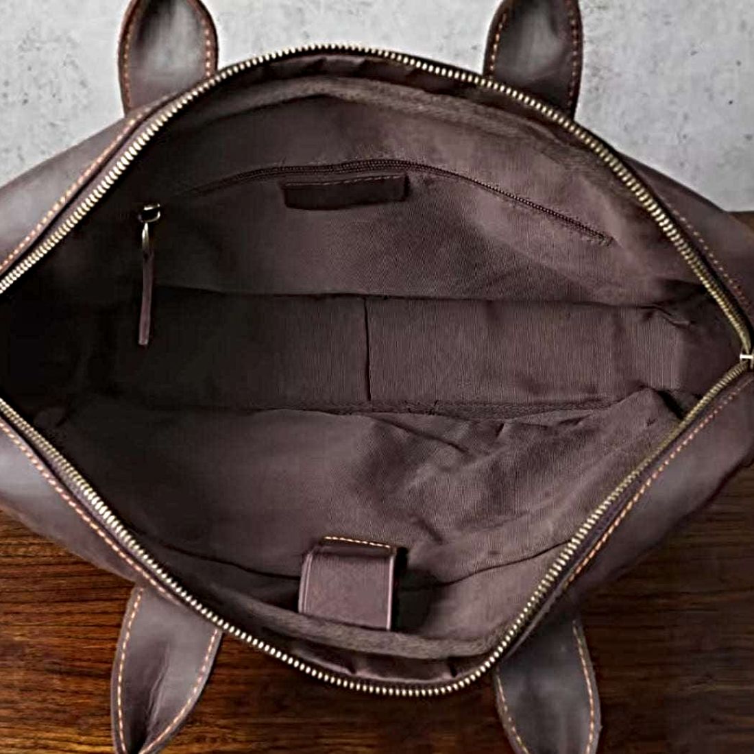 Prestige Leather Briefcase in dark coffee brown full grain luxury genuine leather open top view revealing zippered interior compartments open pockets and key clasp with contrast stitching showcasing premium craftsmanship upscale organization and refined everyday functionality