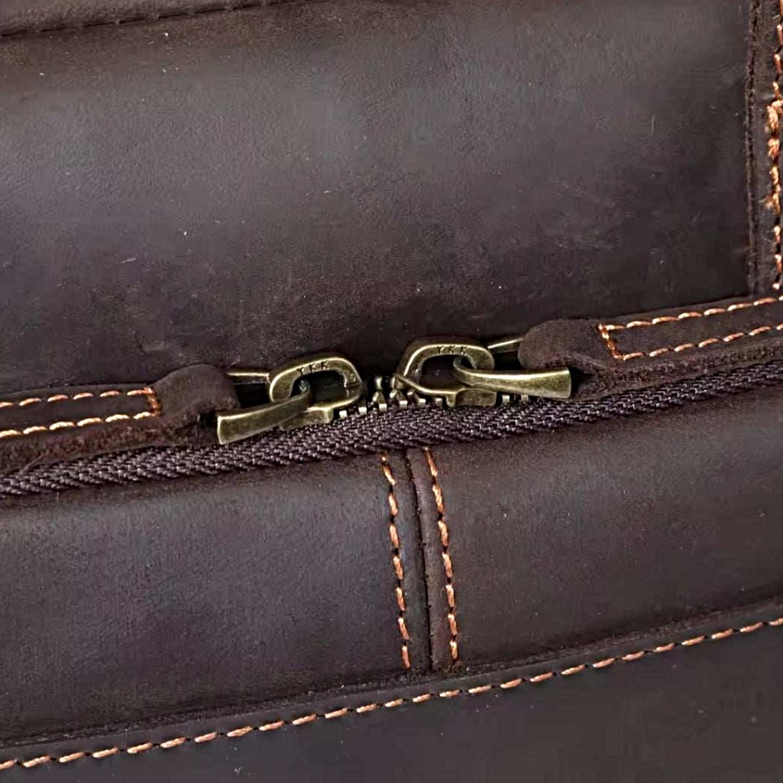 Prestige Leather Briefcase in dark coffee luxury full grain genuine leather close up of dual metal zipper sliders with contrast stitching smooth finish and refined construction showcasing premium materials upscale durability and meticulous craftsmanship