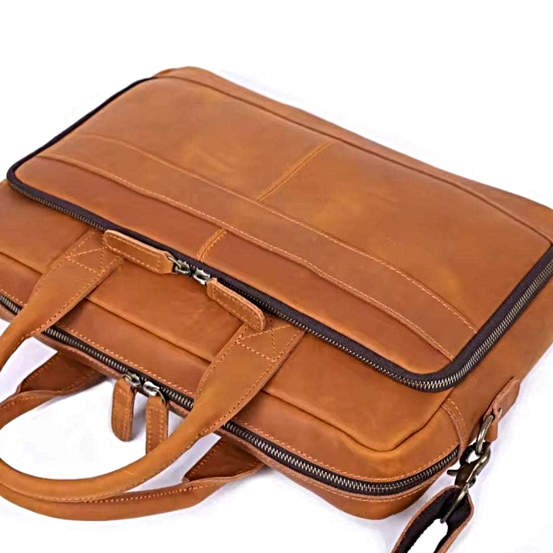Prestige Leather Briefcase luxury full grain brown genuine leather with sleek silhouette dual top handles detachable shoulder strap and zippered compartments refined stitching and polished metal accents designed for upscale durability and confident professional style