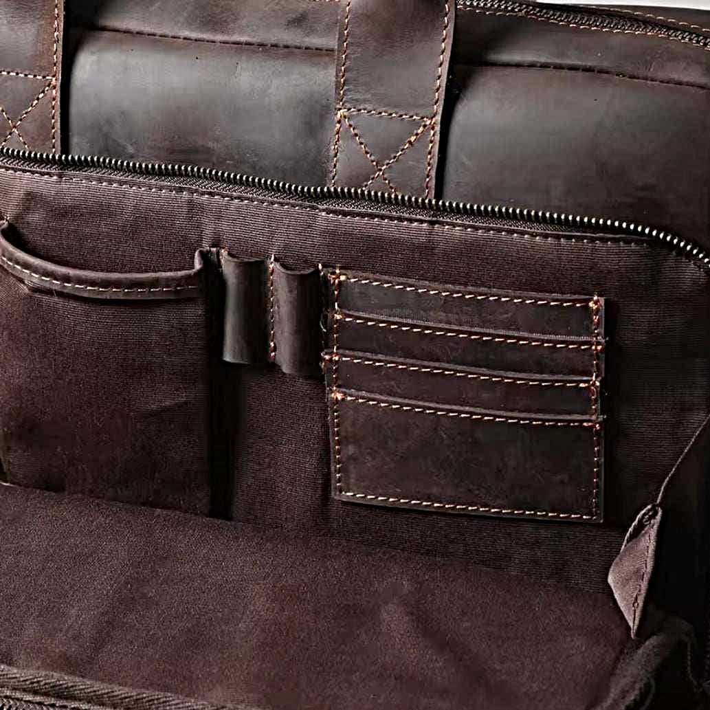 Prestige Leather Briefcase luxury interior in dark brown coffee full grain genuine leather featuring multiple compartments pen holders and stitched pockets with contrast threading showcasing premium craftsmanship upscale rugged texture and organized professional layout