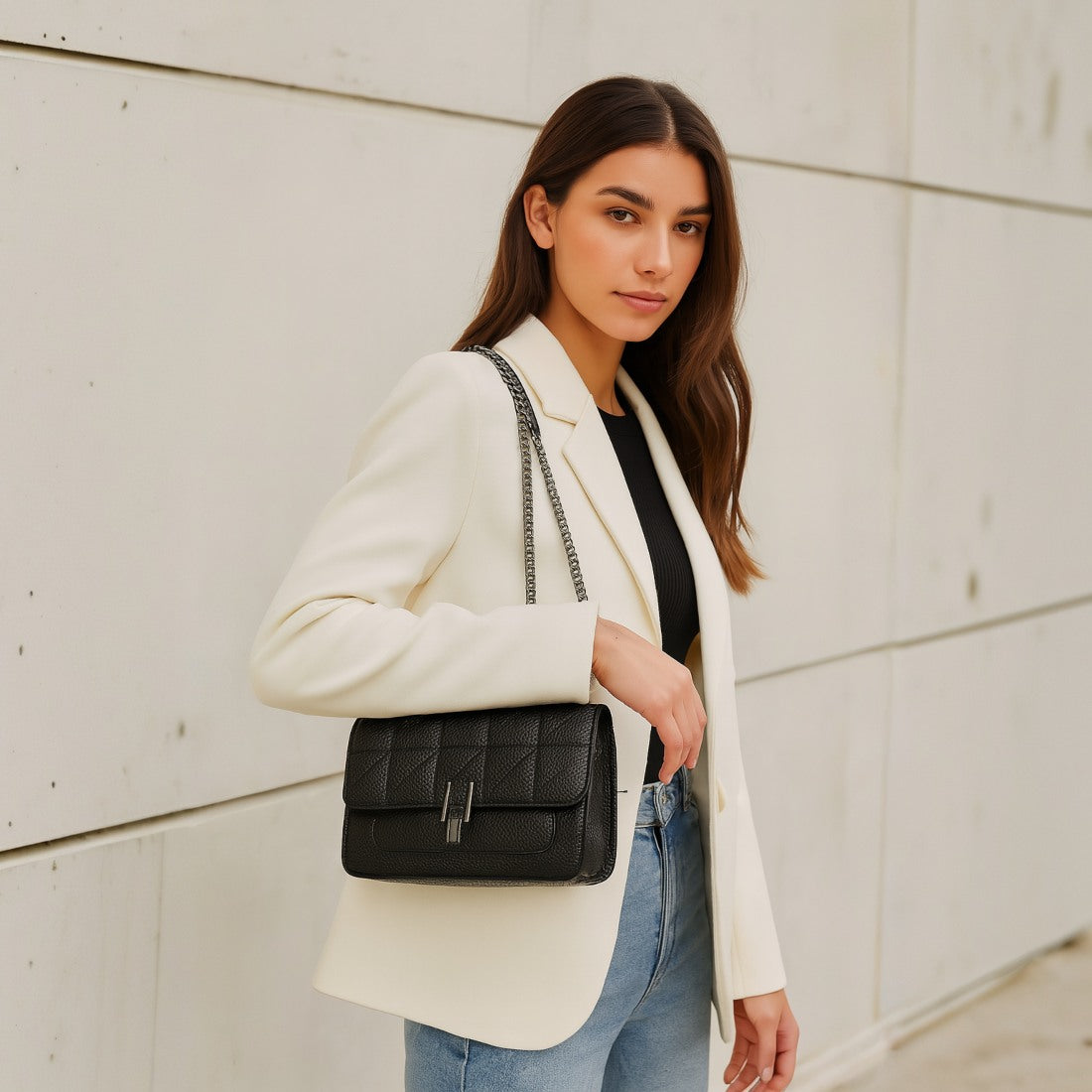 Timeless Quilted Charm luxury vegan leather crossbody in black on model elegant quilted bag with premium upscale silver chain strap on shoulder