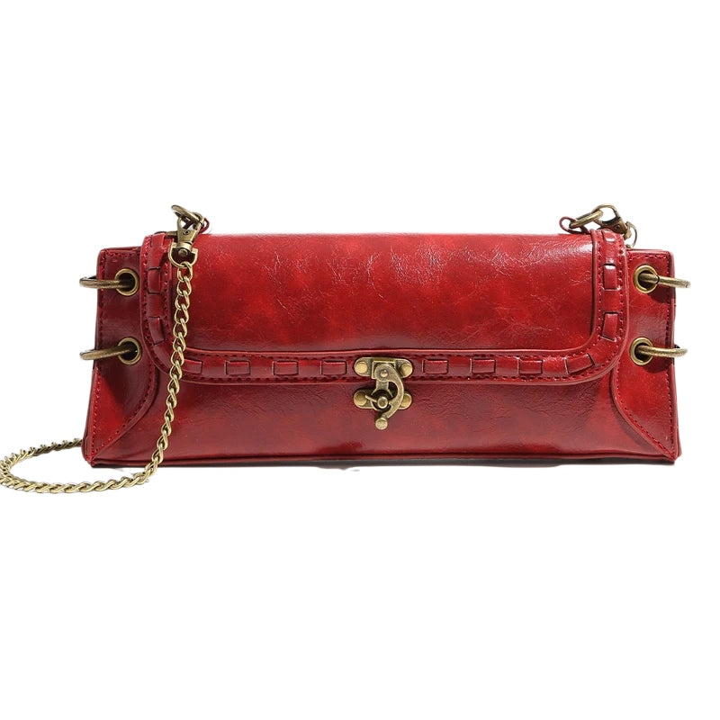 Luxe Chain Carry women’s vegan leather clutch bag in red with chain strap and brass hardware