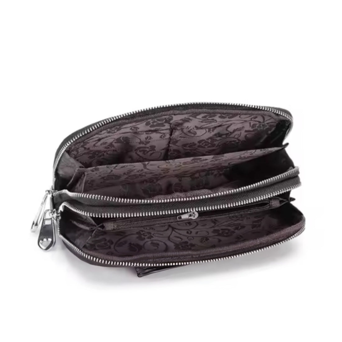 Signature Zip Companion wristlet wallet in black premium genuine leather shown open with dual compartments patterned interior lining and upscale silver zipper hardware showcasing organized layout and elegant multi functional design