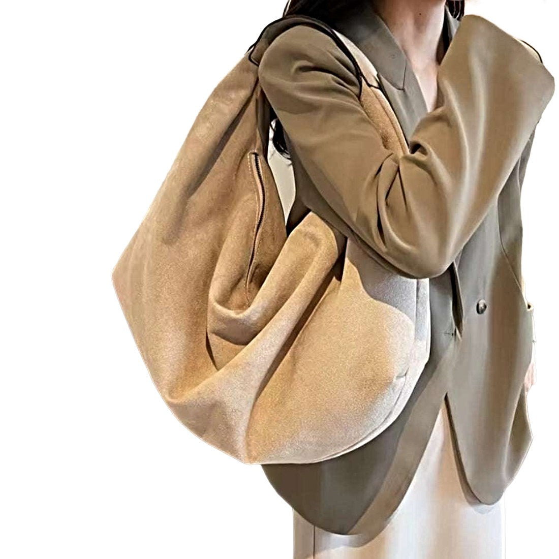Timeless Suede Hobo in luxury beige vegan suede with slouchy crescent silhouette and wide shoulder strap worn over shoulder by model showcasing velvety texture effortless styling and practical everyday elegance carry