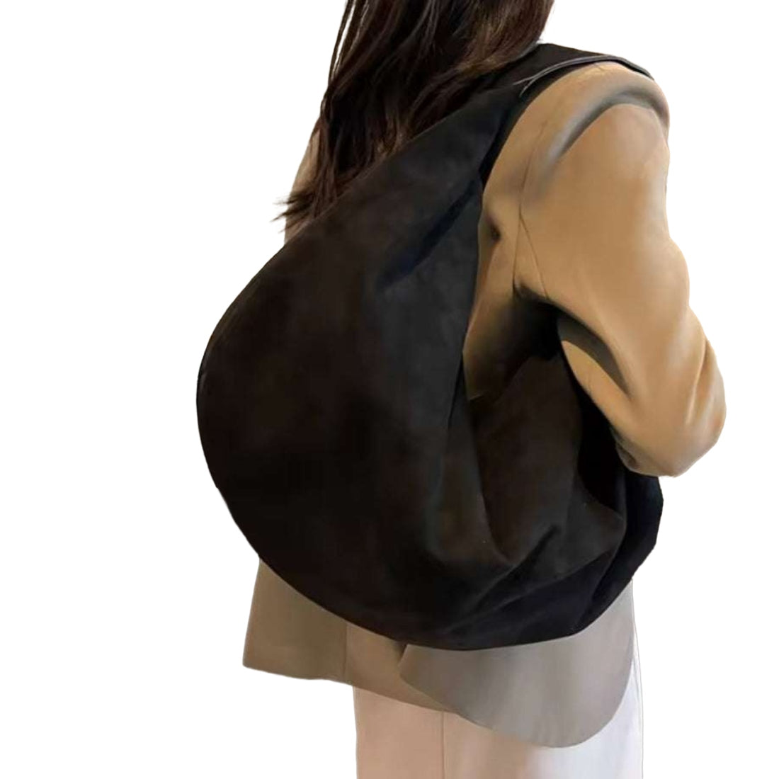 Timeless Suede Hobo in elegant black vegan suede with slouchy crescent silhouette and wide shoulder strap worn over shoulder by model showcasing velvety texture effortless styling and practical everyday luxury carry