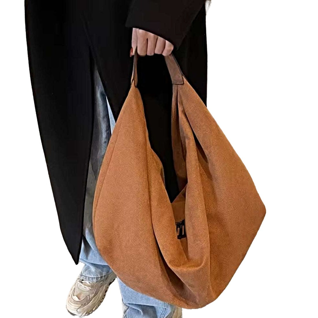Timeless Suede Hobo in chestnut brown luxury vegan suede with slouchy crescent silhouette and wide shoulder strap held by model showcasing elegant velvety texture effortless styling and practical upscale everyday carry