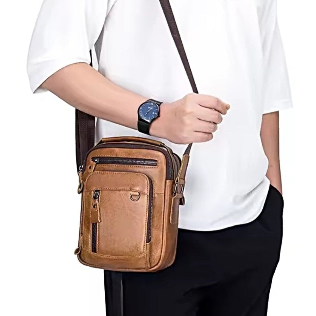 Timeless Axis Crossbody in brown worn on shoulder spacious double deck storage durable genuine leather everyday hands-free upscale rugged style