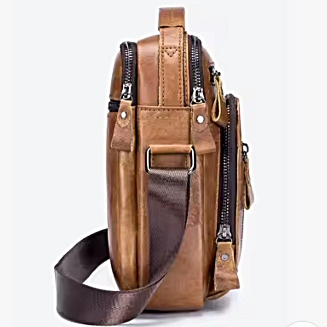 Timeless Axis Crossbody in brown side view spacious durable genuine leather double deck zippers and adjustable web strap