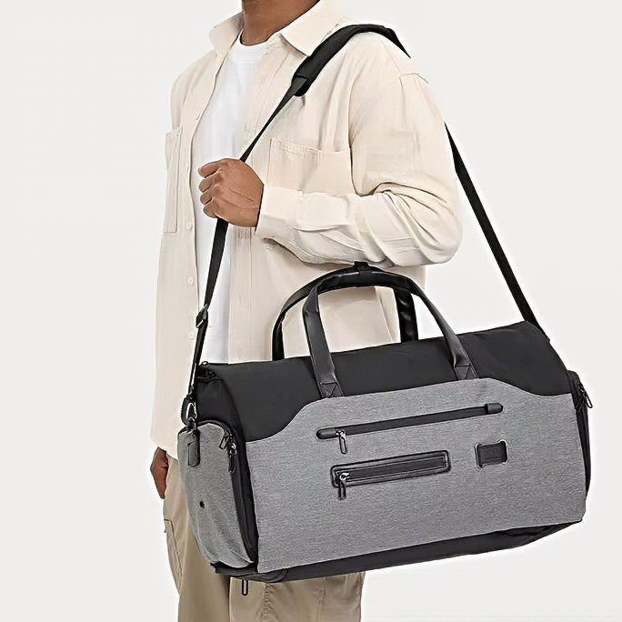 model wearing durable spacious waterproof axis travel companion crossbody shoulder bag mens duffle bag