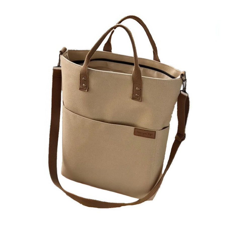 Timeless Canvas Carry in khaki durable upscale premium canvas tote with genuine leather handles, roomy compartments and crossbody strap