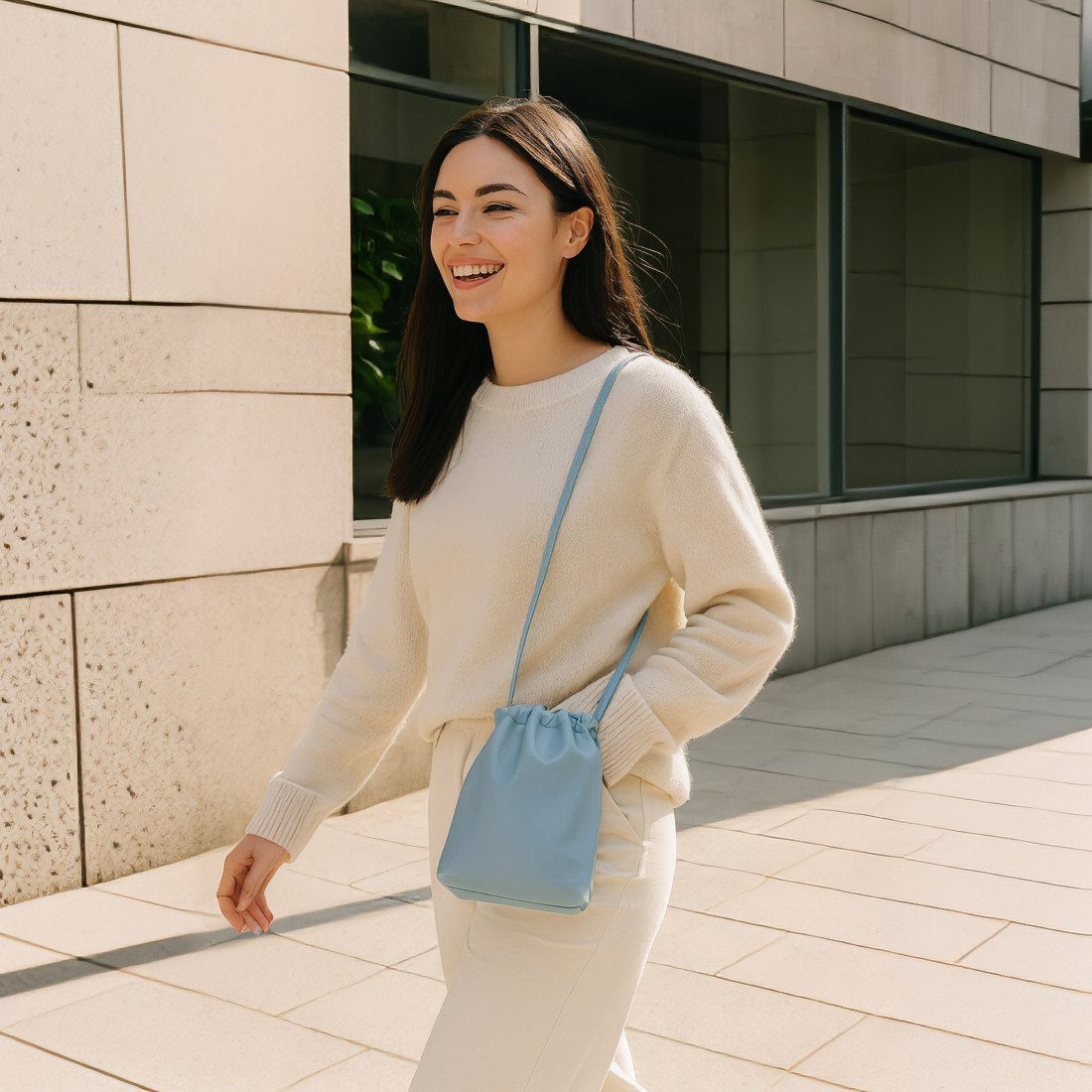 blue pouch vegan leather bags leather crossbody bag with model lifestyle image