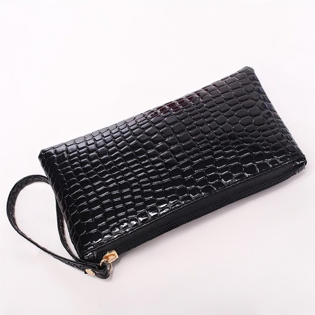 black timeless croc wristlet vegan leather clutch bag pairs with a leather crossbody bag