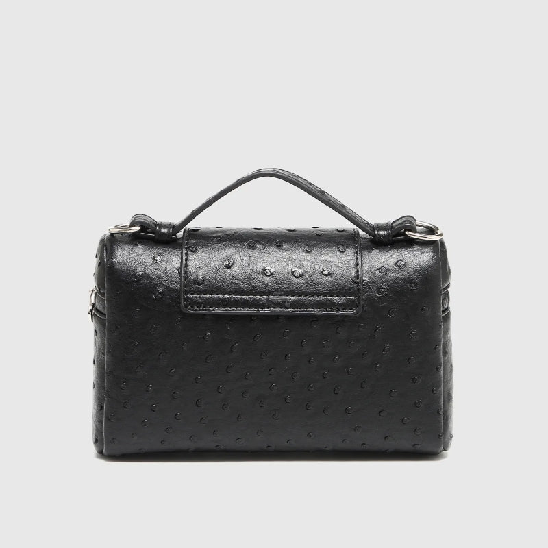 Timeless Petite Luxe women's black vegan leather crossbody bag with top handle and textured finish back view