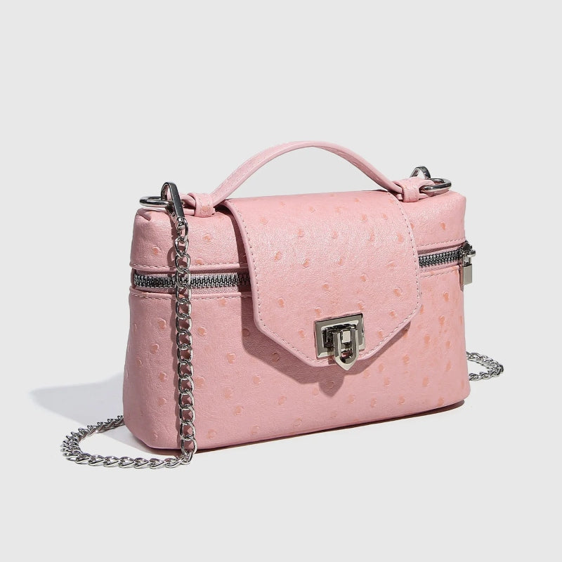 Timeless Petite Luxe women’s crossbody bag in pink vegan leather with chain strap and top handle
