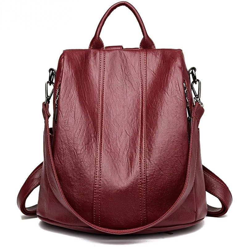 Urban Ease Backpack, women’s vegan leather backpack, burgundy, top handle, adjustable straps, silver hardware