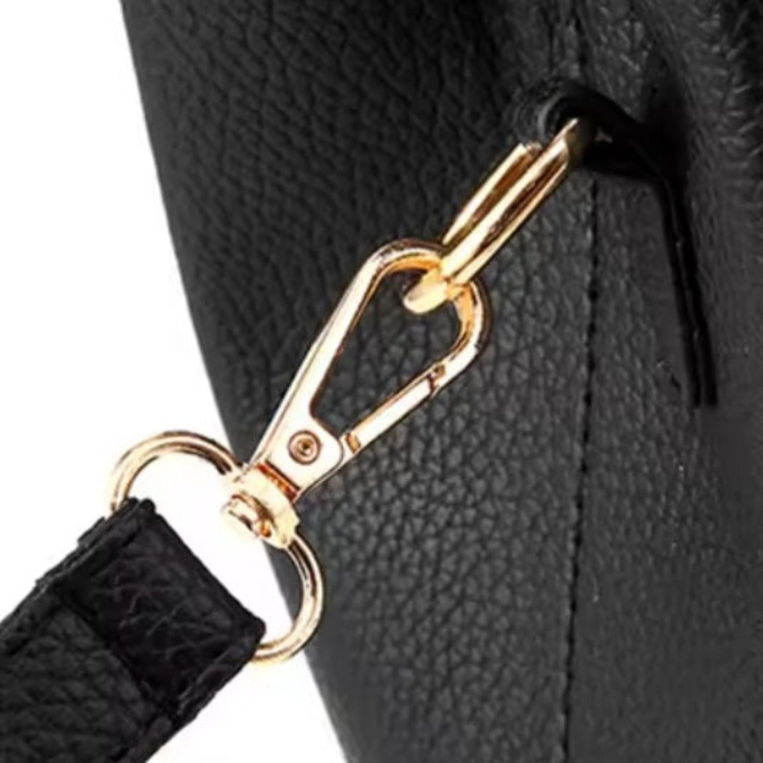 Urban Elegance Satchel in black vegan luxury leather shown in close up view of gold tone swivel clasp attached to side loop with visible pebbled texture shoulder strap showcasing refined hardware detailing durable premium construction and elevated everyday functionality