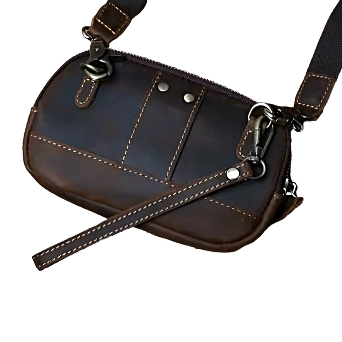 Heritage Utility Carry  in dark brown genuine crazy horse leather with distressed oil wax finish rectangular silhouette with rounded edges white stitching brass zipper and adjustable buckle strap showcasing vintage utility and upscale craftsmanship