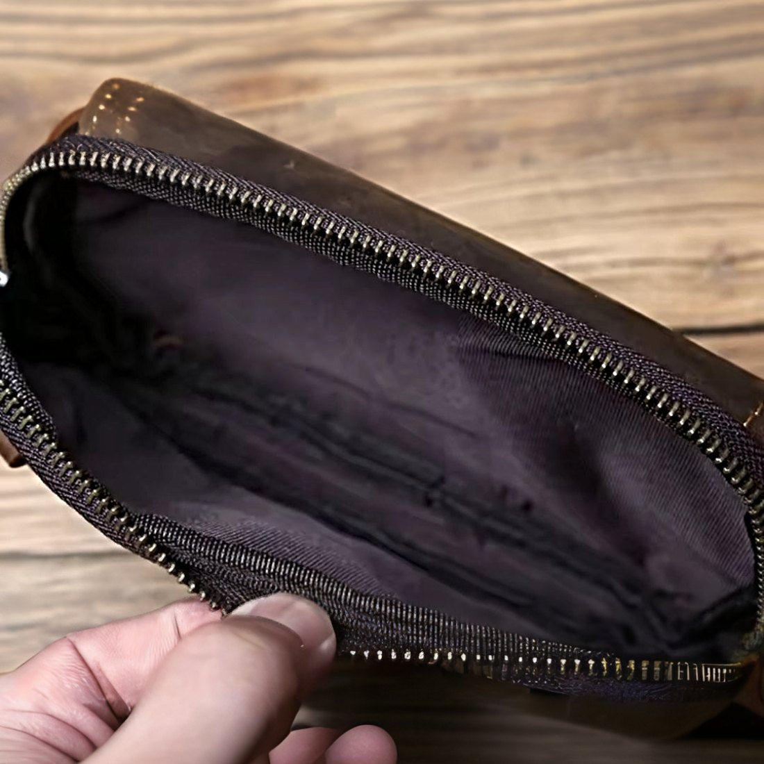 Heritage Utility Carry in dark brown crazy horse genuine leather with distressed oil wax finish held open to reveal dark fabric lining and spacious interior vintage craftsmanship and upscale functional design