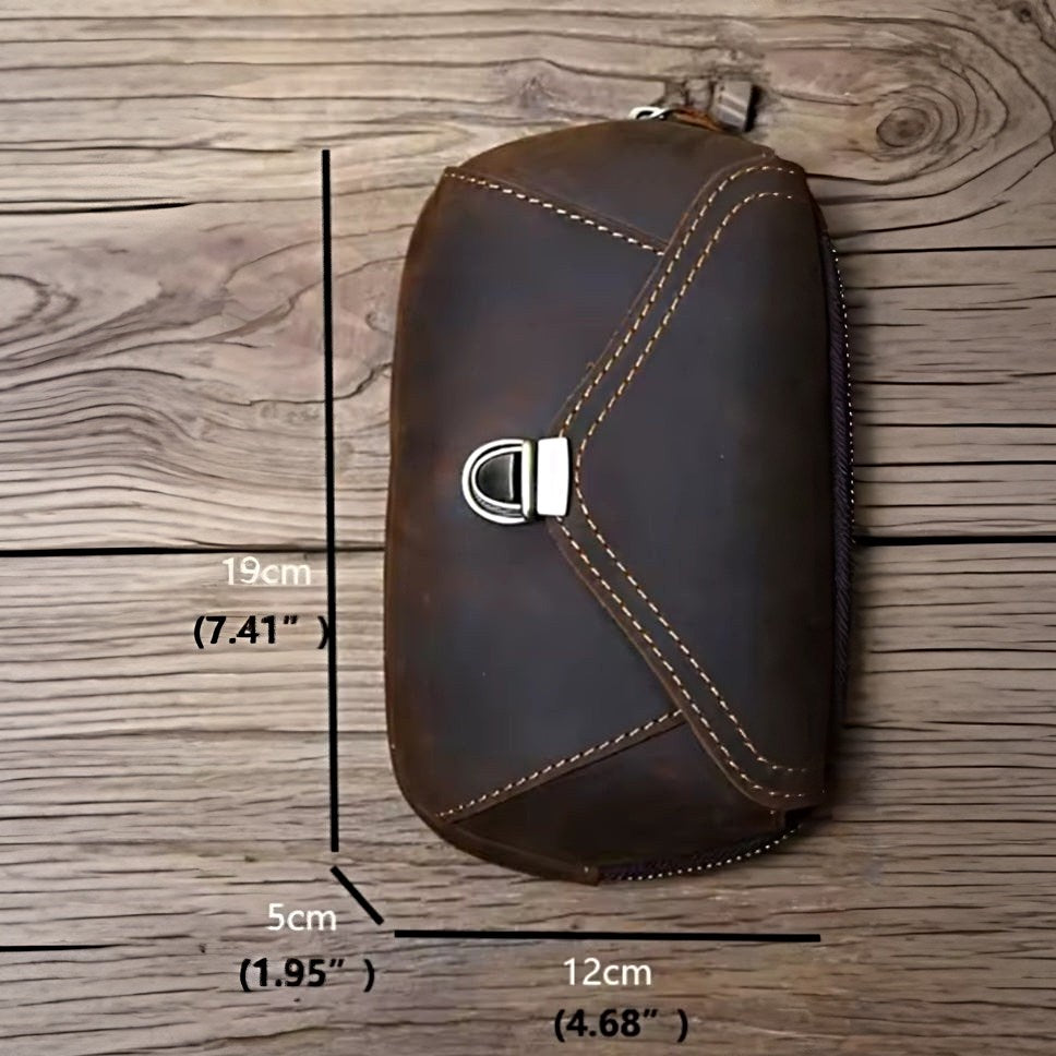 Heritage Utility Carry bag in dark brown genuine crazy horse leather with distressed oil wax finish rectangular silhouette with rounded edges white stitching brass zipper and adjustable strap displaying measurements