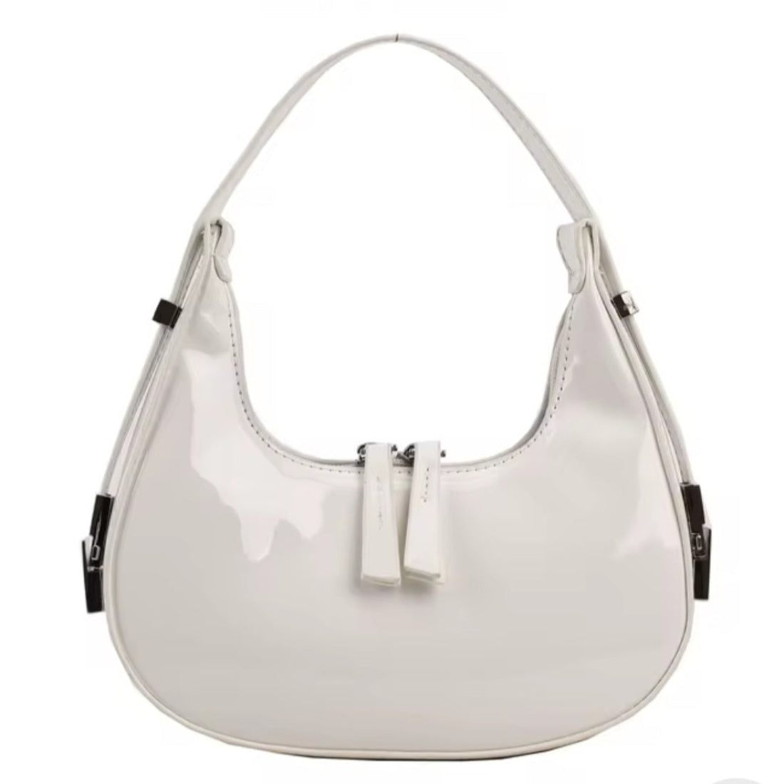 Luna Curve Carry luxury bag in glossy white vegan leather with elegant crescent silhouette short shoulder strap silver hardware accents and front tab detail showcasing crisp modern styling polished premium finish and compact everyday elegance